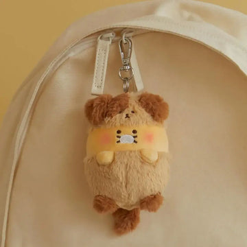 Plush keychain of a puppy character with brown hair on a white background