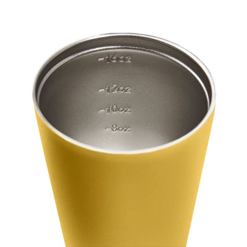 A tall travel mug in yellow with a black lid and the text 'made by Fressko' on the bottom.