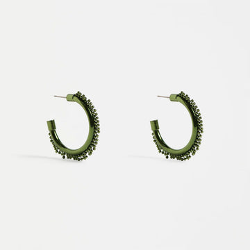 Pair of green hoop earrings on a white background.