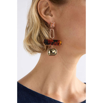 Pair of earrings with tortoiseshell and gemstone design on a white background.
