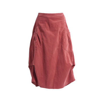 A dark blush red corduroy skirt with side pockets and side tucks.