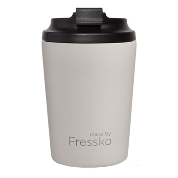 White coffee tumbler with black lid on a white background, branded 'made by Fressko'.