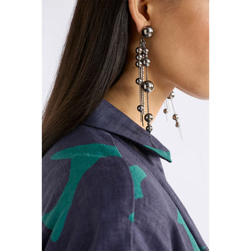 Pair of silver beaded earrings on a white background.