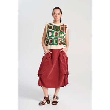 A dark blush red corduroy skirt with side pockets and side tucks.