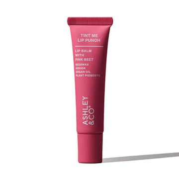 A pink tube filled with lip balm with the heading 'Tint Me Lip Punch' followed by product information.