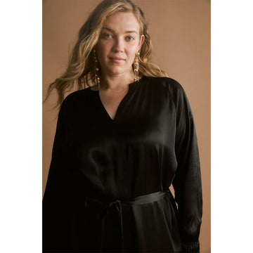 Gold chandelier earrings on a white background.