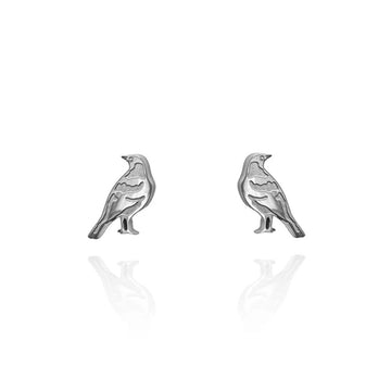 A pair of silver stud earrings shaped like magpies.