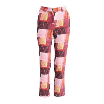 A pair of women's pants printed with a red and pink rectangle pattern.