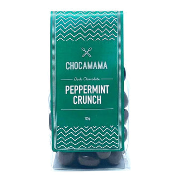 A clear bag filled with chocolate bites and a green product label.