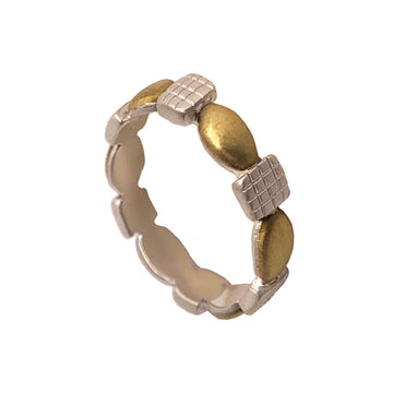 A ring featuring gold ovals and silver squares in an alternating pattern around the band.