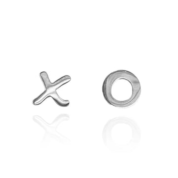 A pair of silver stud earrings, one shaped like an x and the other shaped like an o.