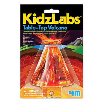 A volcano toy inside clear packaging attached to a card with the heading 'KidzLabs Table Top Volcano'.