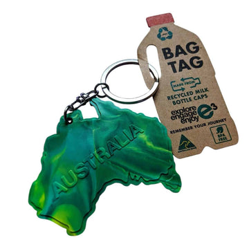 Keychain shaped like a map of Australia with a recycling-themed bag tag on a white background.