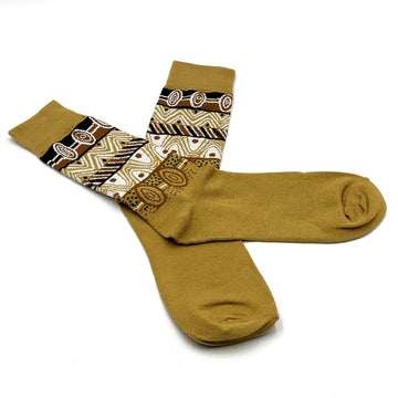 A pair of socks with one laying over the top of the other and printed with artwork by Josette Papajua.