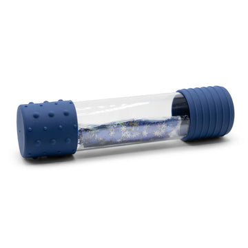 A clear bottle with dark blue silicone sides and a packet of confetti glitter inside.