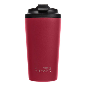A tall travel mug in rouge red with a black lid and the text 'made by Fressko' on the bottom.