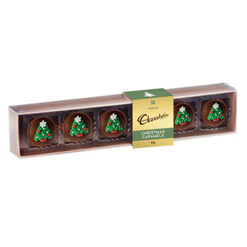 Six round chocolates decorated with Christmas trees in a rectangle box.