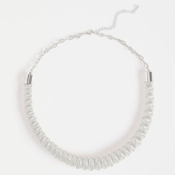 A silver necklace with a chunky zig zag pattern.