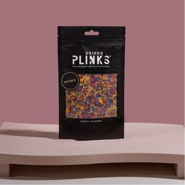 A black packet with a clear square window showing edible flowers inside.