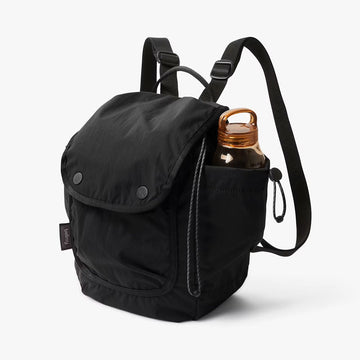 Black backpack with a bottle inside on a white background.