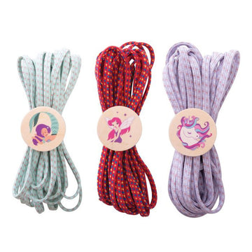 Three different coloured jump elastics tied up with a wooden button on the front illustrated with a mermaid, fairy and unicorn.