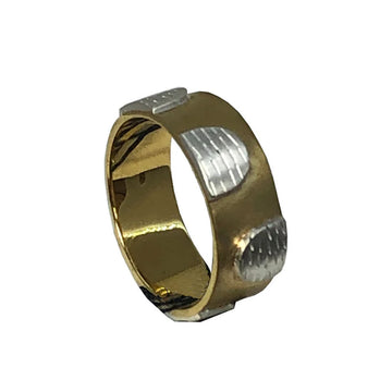 A gold ring with silver semi circles alternating sizes on the ring.