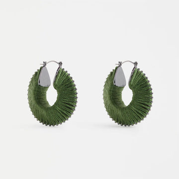 Pair of green hoop earrings on a white background.