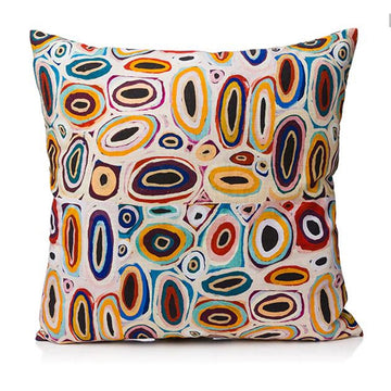 A square cushion printed with artwork by Gladys Kuru Bidu.