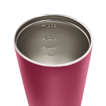 A tall travel mug in rouge red with a black lid and the text 'made by Fressko' on the bottom.