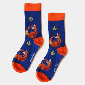 A pair of dark blue socks with an orange heel, toe and cuff illustrated with kangaroos.