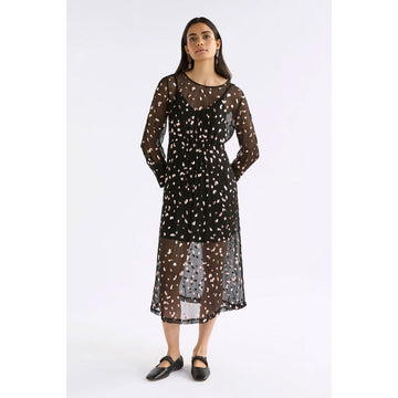 A long sleeve sheer black dress with gold foil accents.