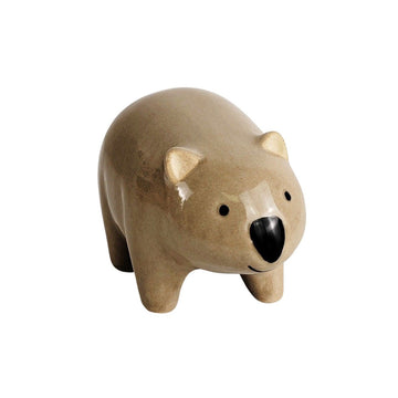 A ceramic wombat designed to sit on the side of a pot.