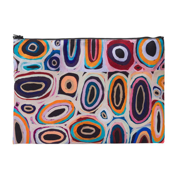 A zip purse printed with artwork by Gladys Kuru Bidu with circles in different colours.
