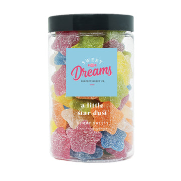 A clear jar filled with colourful star shaped gummy lollies with the heading 'a little star dust'.