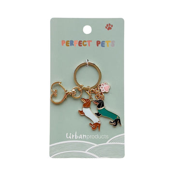 A keyring with two sausage dogs charms attached to a card with the heading 'Perfect Pets'.