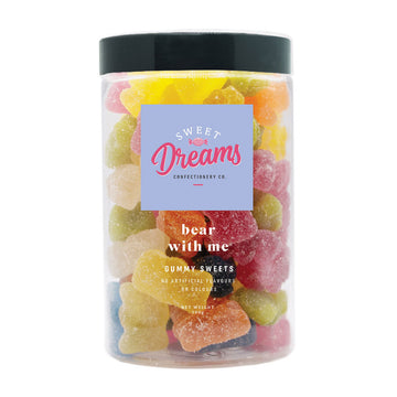 A clear jar filled with bear shaped lollies with the heading 'bear with me'.