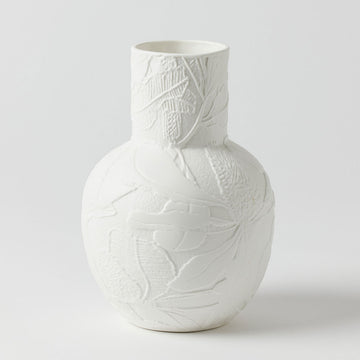 A white vase with embossed detail of flowers and leaves.