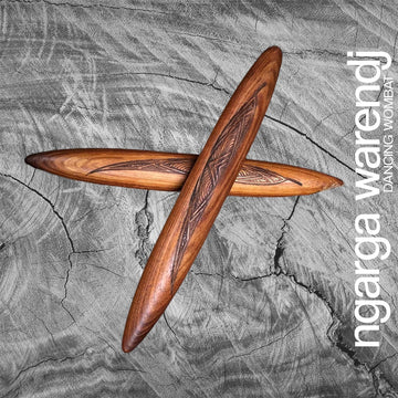 Wooden clap sticks with intricate designs on a textured gray background, featuring the brand 'ngarga warendj'.