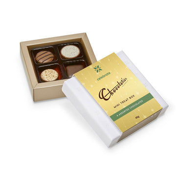 A small box with four different chocolates inside.