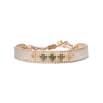 Beaded bracelet with geometric pattern on a white background.