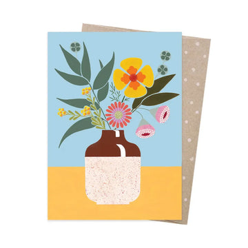 Greeting card with floral design and brown vase on blue and yellow background.