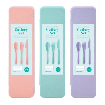 Three cutlery sets in coloured boxes in peach, mint green and purple.