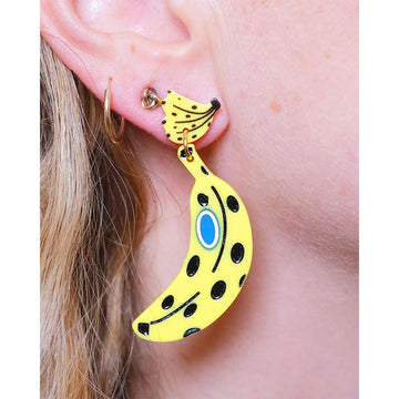 Banana-shaped earrings on a white background.