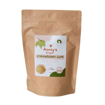 A brown packet with a sticker on the front with the text 'Aunty's Damper Strawberry Gum Playdough Mix'.