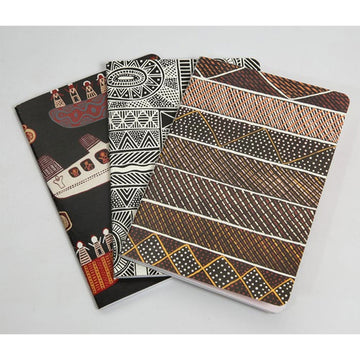 A set of three notebooks each printed with a different artwork by Munupi artists.