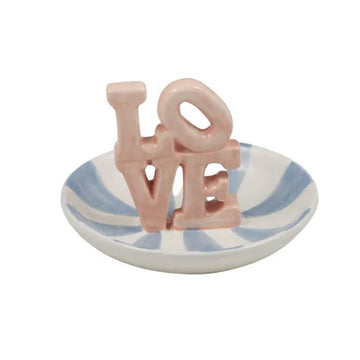 A round ceramic trinket dish in blue stripes with the letters 'LOVE' stacked up in the middle of the bowl.