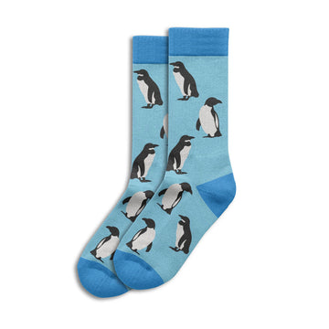 Pair of socks with penguin design on a light blue background.