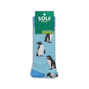 Pair of socks with penguin design on a light blue background.