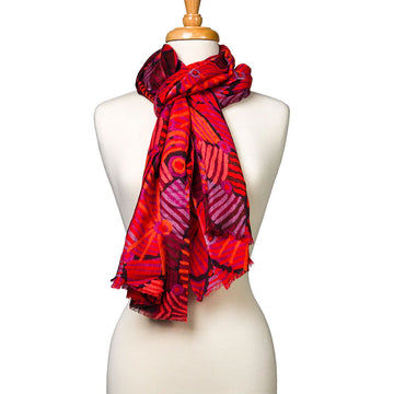 A woollen scarf printed with artwork by Helen Robertson is wrapped around the neck of a mannequin.