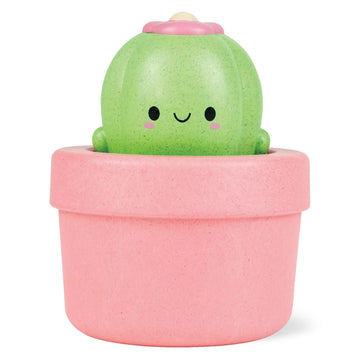 A bath toy shaped like a cactus in a pink pot.